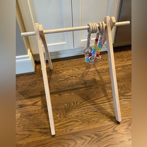 Wee little hedgehog wood baby gym with silicone toys